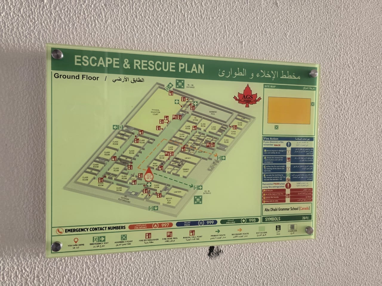 Building emergency evacuation plan mounted on a wall