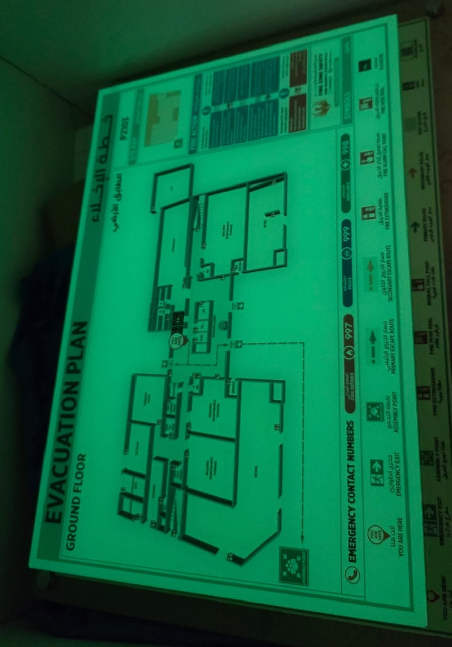 Framed fire evacuation plan installed near a lift lobby